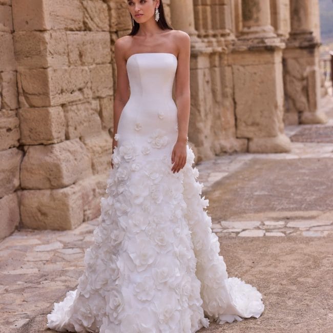 Fit and flare wedding dress with an applique skirt