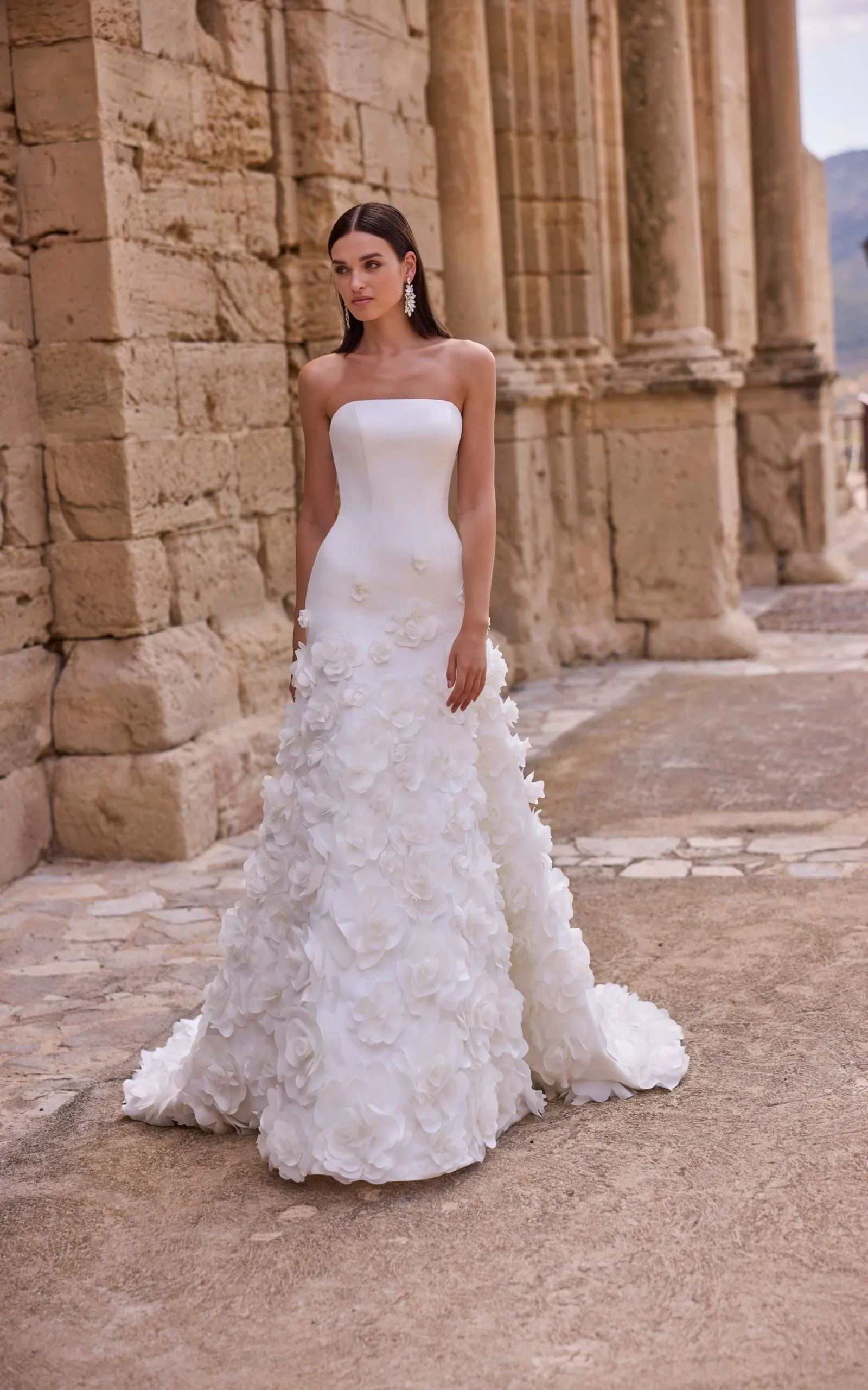 Fit and flare wedding dress with an applique skirt