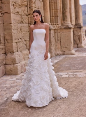 Fit and flare wedding dress with an applique skirt